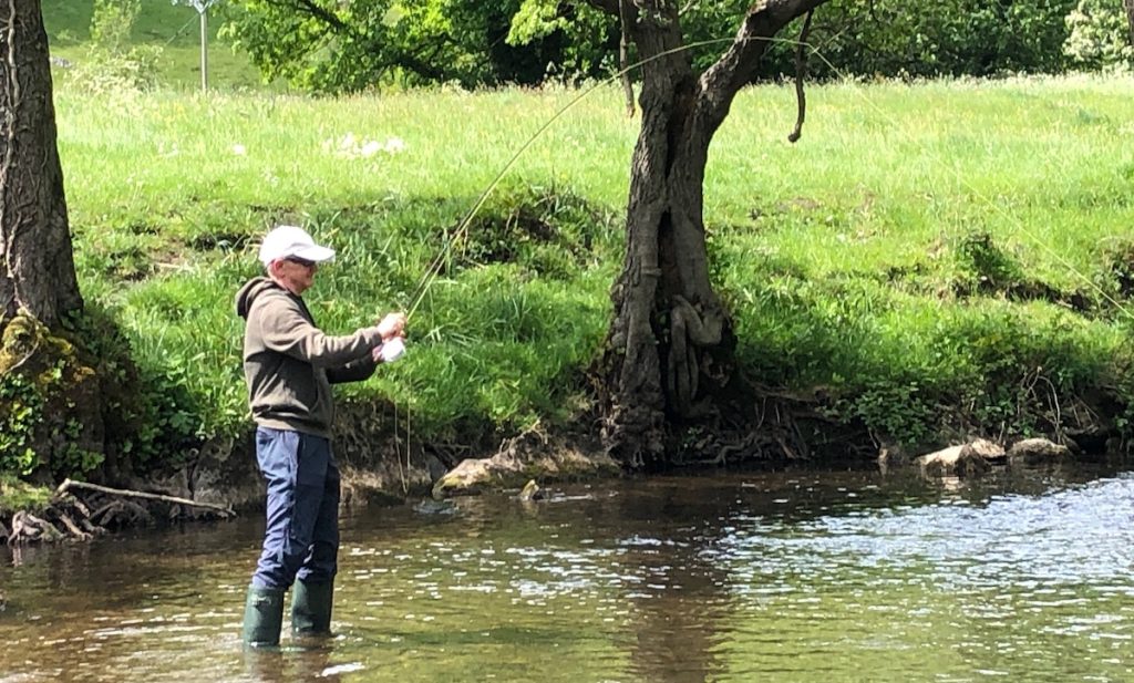 hooking a trout on a dry fly during June.